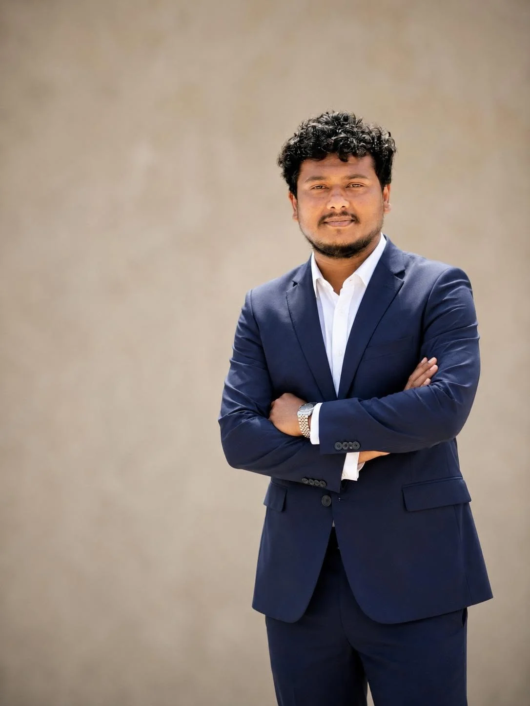 Sarim Noor in a navy suit